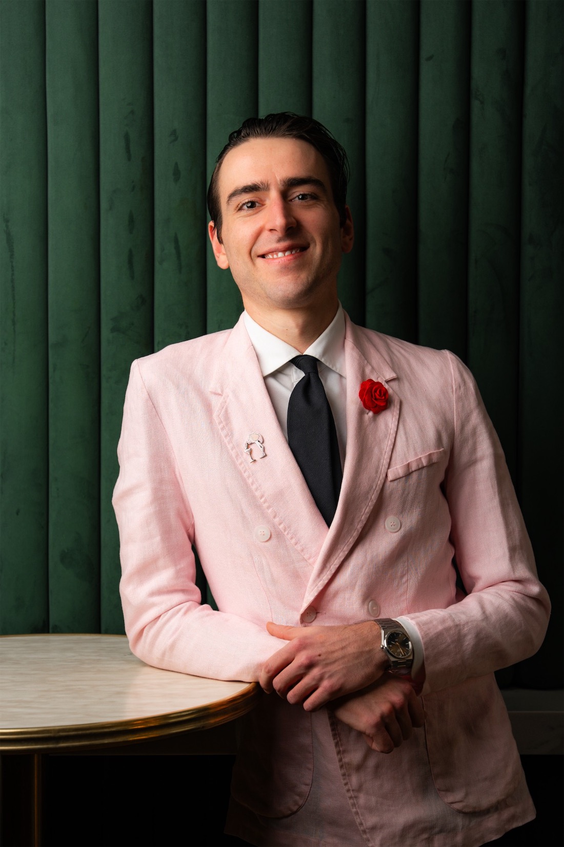 Giorgio, founder of Caffè Gianni, in a pink linen suit