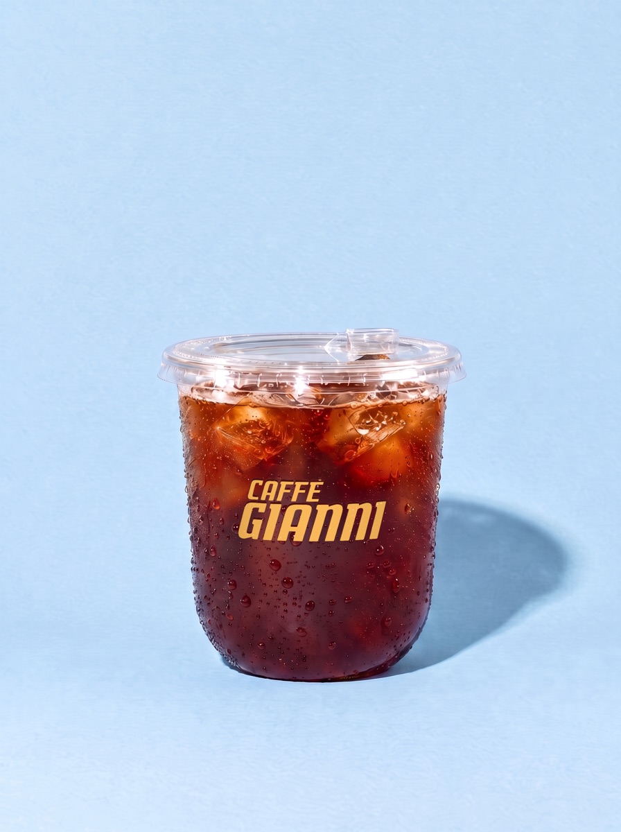 COLD BREW over ice with a sip lid, in a Caffè Gianni cup